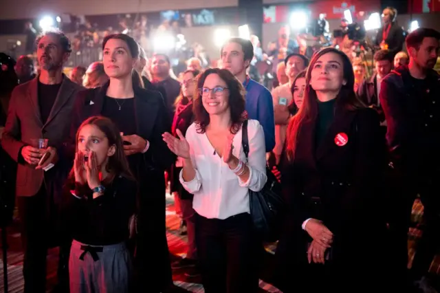 Supporters of Liberal party candidate, Justin Trudeau, react to the announcements of the first results at the Palais des Congres in Montreal during Team Justin Trudeau 2019 election night event in Montreal