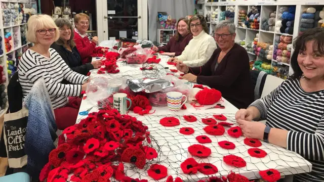 People making the poppies