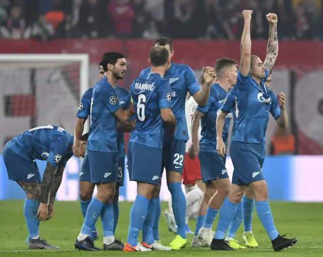 Zenit St Petersburg's Ukrainian defender Yaroslav Rakitskiy (R) celebrates scoring the 0-1 during the UEFA Champions League Group G football match RB Leipzig vs Zenit St Petersburg in Leipzig