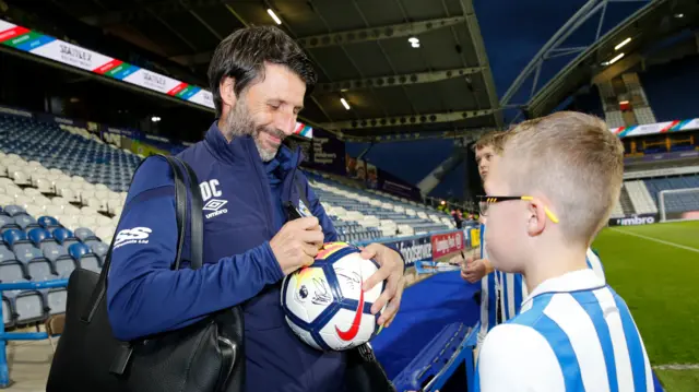 Danny Cowley signs an autograph