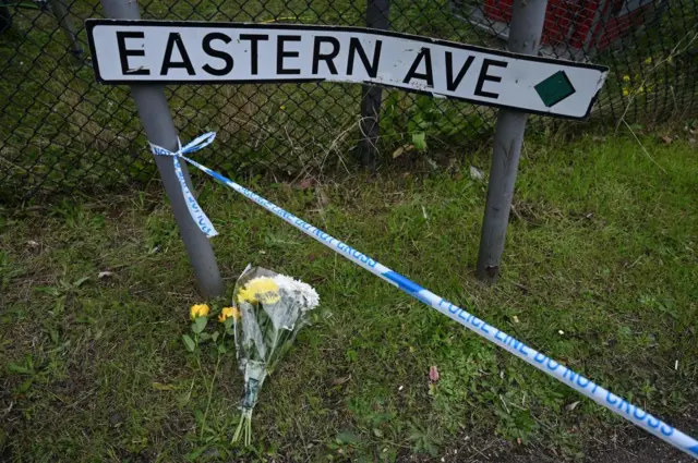 Floral tribute next to Eastern Avenue sign, Grays, Essex