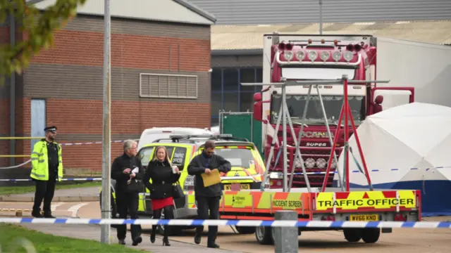 Police at the scene where 39 bodies were found in a container in Grays, Essex