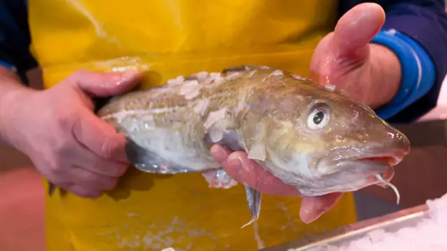 A fisherman with a cod