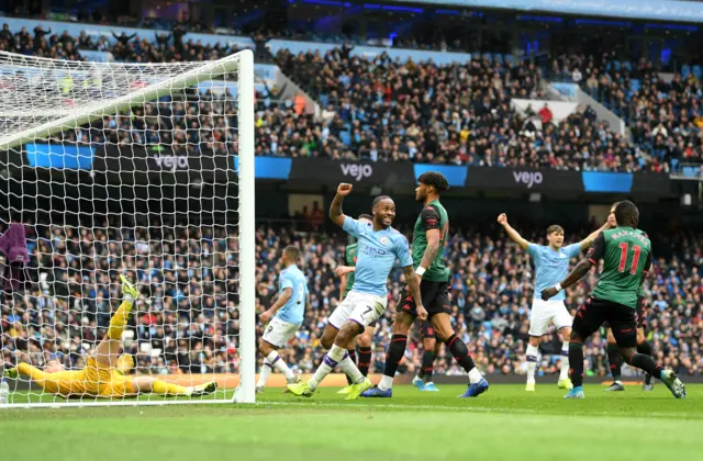 Raheem Sterling celebrates Manchester city's second goal