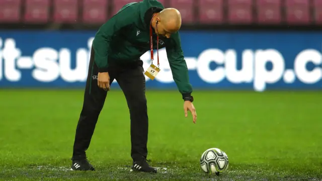 Referee with football