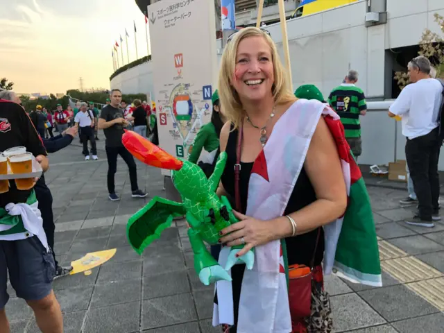 A woman with a blow-up dragon