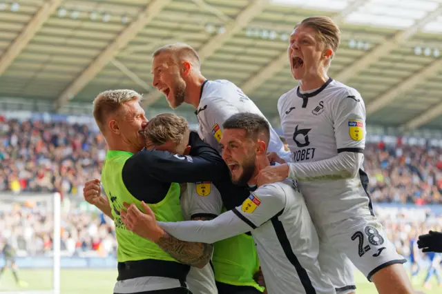 Ben Wilmot of Swansea City celebrates his goal with team mates