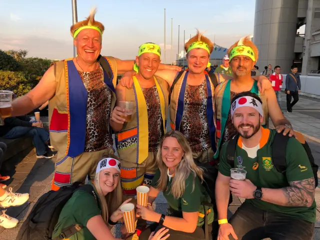 South Africa fans dressed in leopard print and beige waistcoats