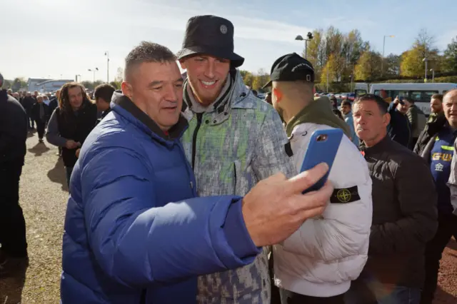 Oli McBurnie poses for a photo with a fan