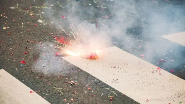 Exploding firework on ground