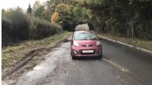 Abandoned car on A438