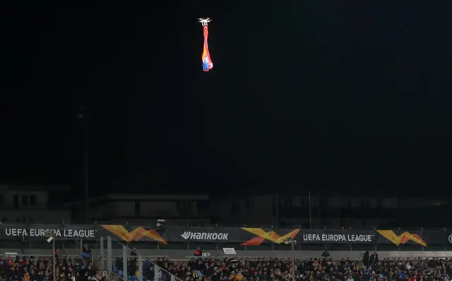 General view as a drone flies over the pitch interrupting the match