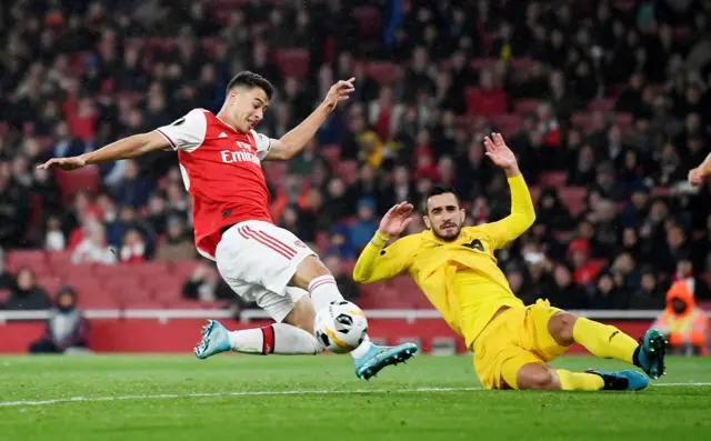 Arsenal's Gabriel Martinelli in action with Standard Liege's Konstantinos Laifi