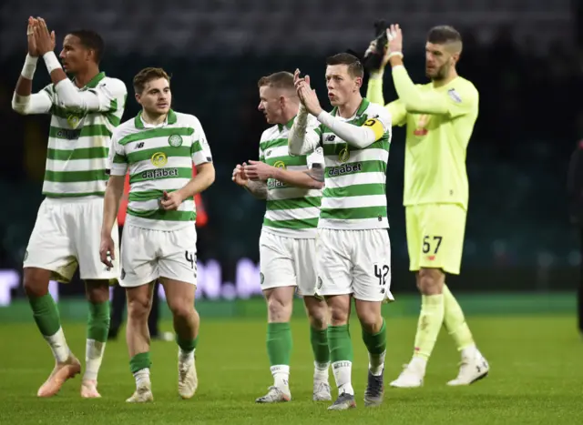 Celtic players applaud the crowd at full-time