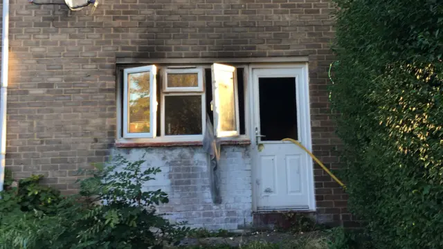 Cloth hanging from window after fire