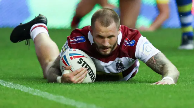 Zak Hardaker scores a try for Wigan