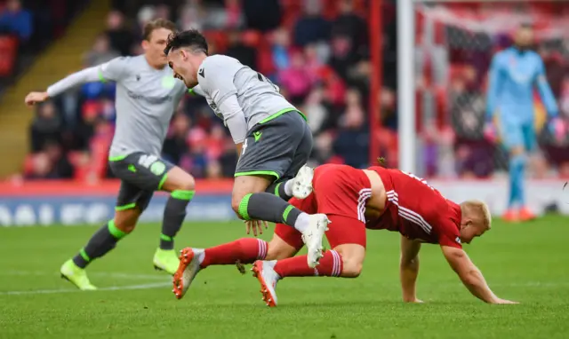 Curtis Main tackles Stevie Mallan