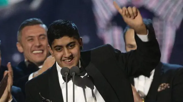 Musharaf "Mushy" Asghar collects Educating Yorkshire's award at the 2014 National Television Awards