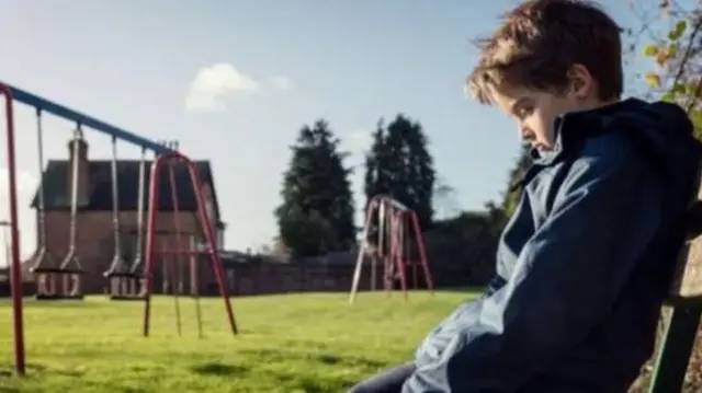 Child on bench at playground