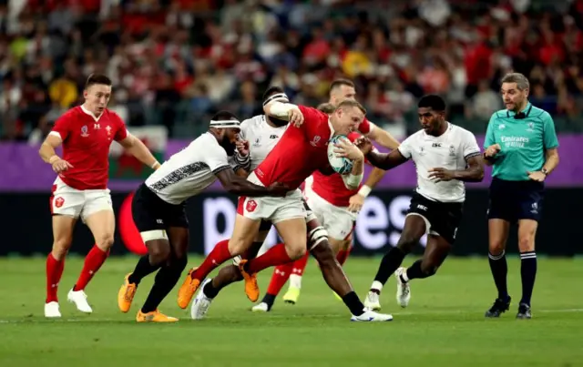 Hadleigh Parkes is tackled by Semi Kunatani and Levani Botia