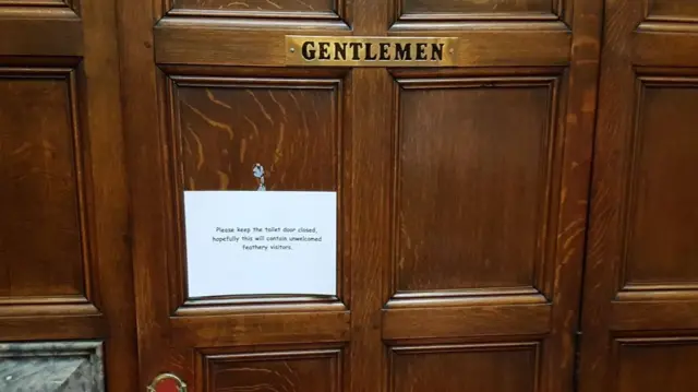 A sign on the door