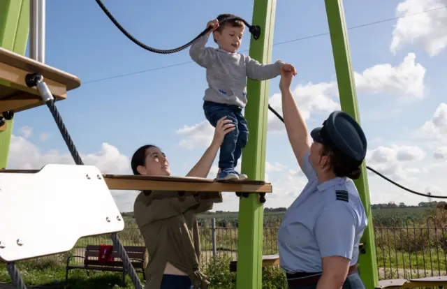 Child on play equipment