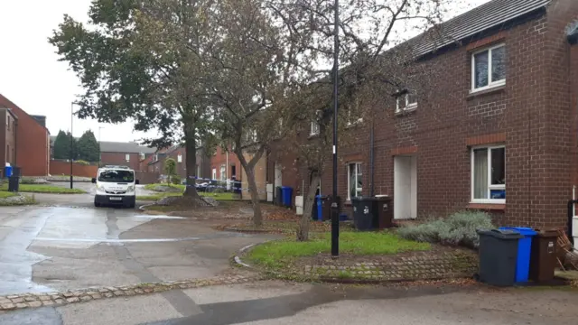 A police van outside a house