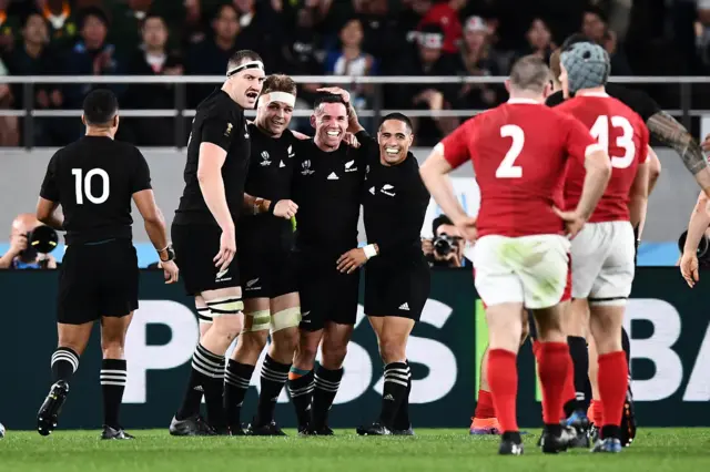 New Zealand players congratulate Ryan Crotty