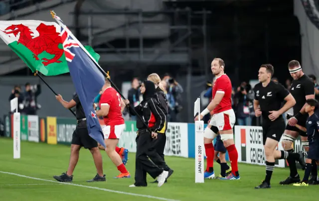 The teams walk out, with Wales led by Alun Wyn Jones