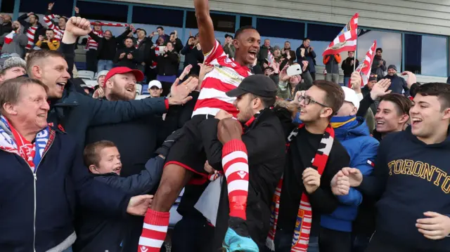 Kingstonian celebrate their win over Macclesfield