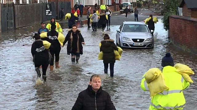 People with sandbags