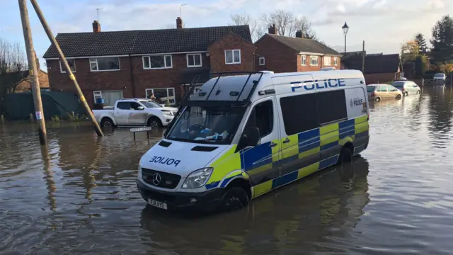 Police van in Doncaster floodwater