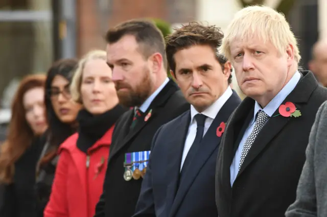 Prime Minister Boris Johnson (right) and Defence Minister Johnny Mercer (centre) during a service at the cenotaph in St Peter"s Square, Wolverhampton, to mark Armistice Day,