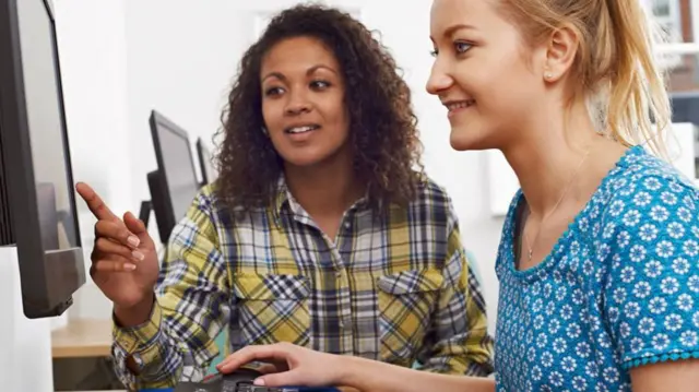 Women looking at a computer