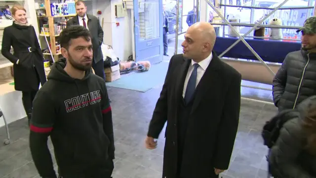 Sajid Javid visits a carpet shop in Bristol