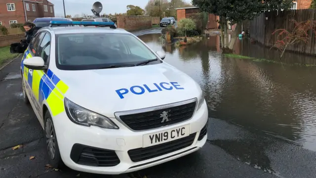 A police car in the floods