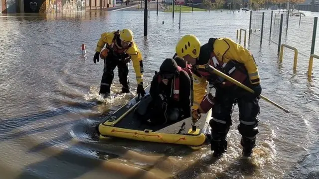 Someone being rescued in a boat