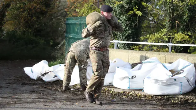 Army moving sandbags