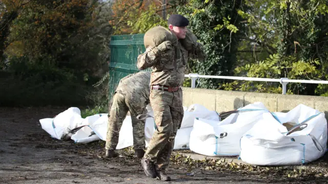 Army moving sandbags