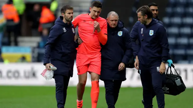 Tommy Elphick after injuring his knee