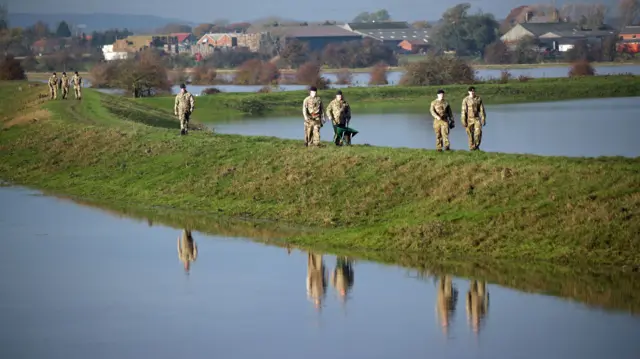 Army moving sandbags