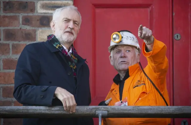 Labour leader Jeremy Corbyn meets former miner John Kane, aged 82, during a visit to the National Mining Museum at the former Lady Victoria Colliery, Newtongrange