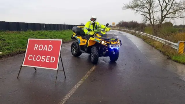 A police officer on a quad bike