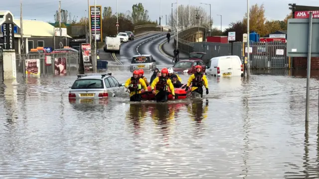 Fire teams working in flood water