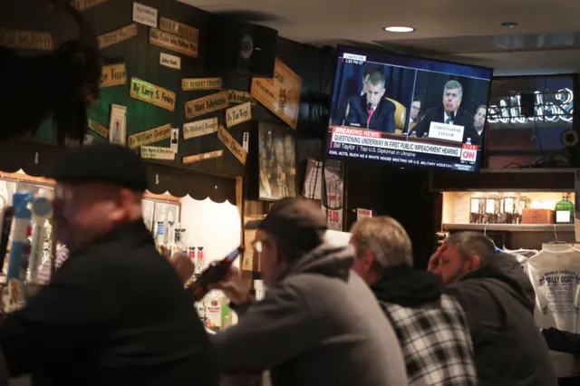 Americans watch the hearing