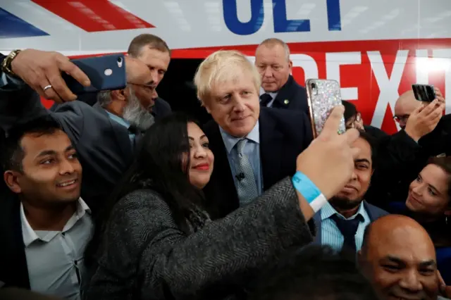 Boris Johnson with his election campaign bus