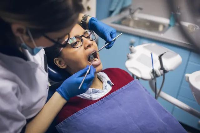 Woman having a dental check--up