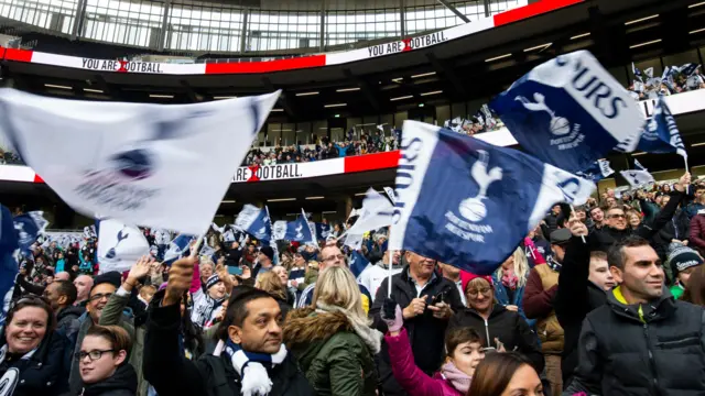 Spurs fans wave flags