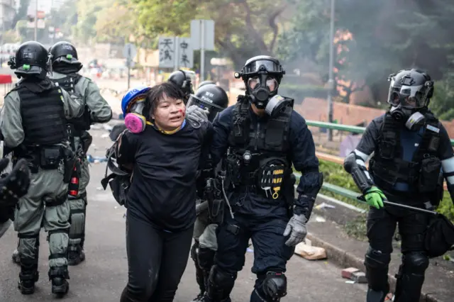 Police arrest anti-government protesters at Hong Kong Polytechnic University on November 18, 2019 in Hong Kong, China.