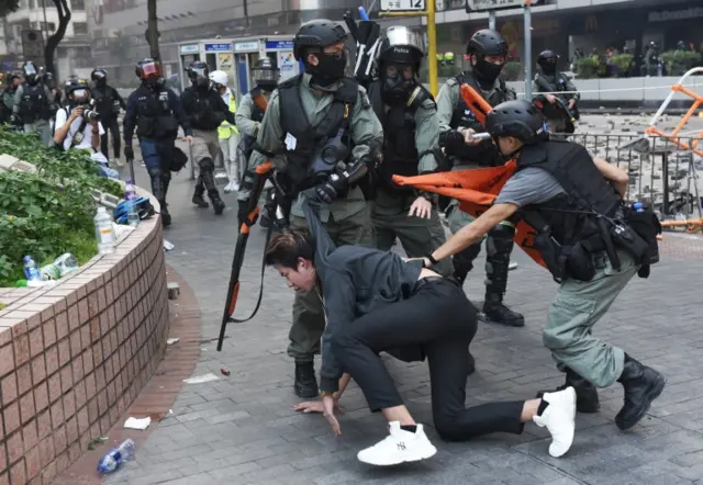 Riot police detain protesters in Hong Kong